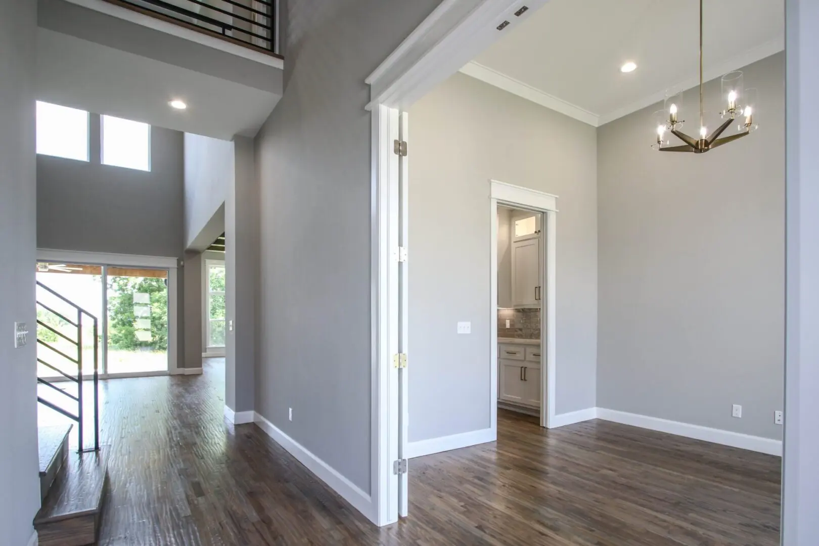 A room with wood floors and walls painted gray.