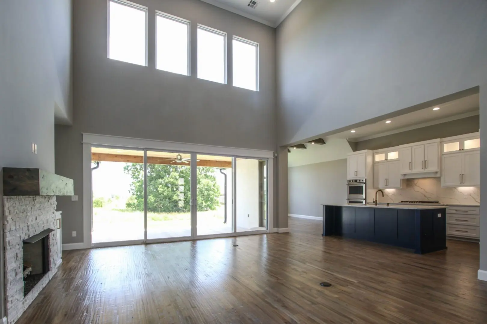 A large open floor plan with sliding glass doors.