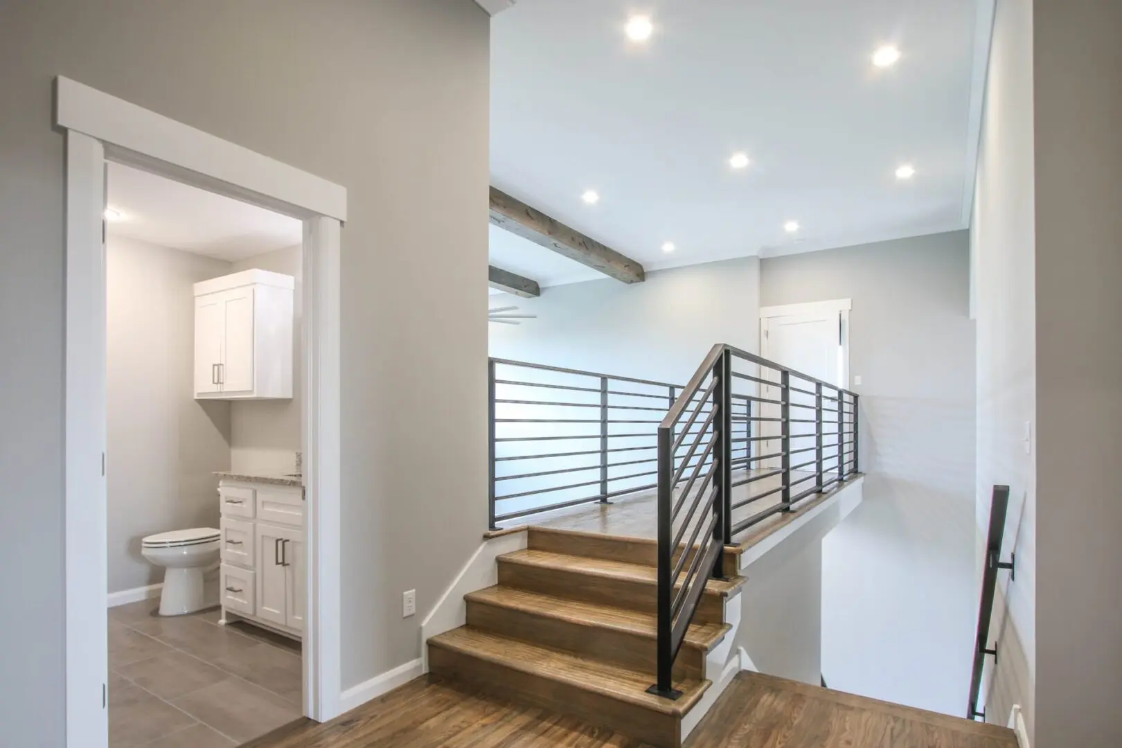 A room with stairs and a railing in it